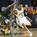 Michigan sophomore Trey Burke moves the ball around Cleveland State sophomore Trey Lewis during the first half of an NIT Season Tip-Off game at Crisler Center on Tuesday. Melanie Maxwell I AnnArbor.com